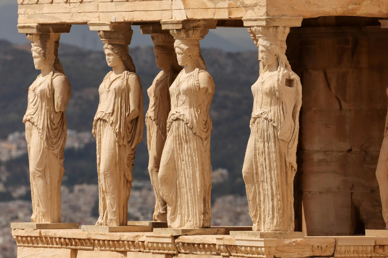 Travel insurance for Greece visa from Morocco featuring Athens and Santorini